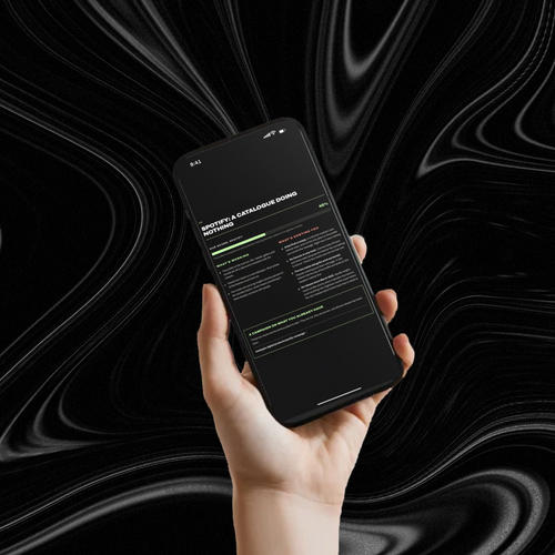 A Bad Apple Artist Audit open on a phone, held against a black marbled background
